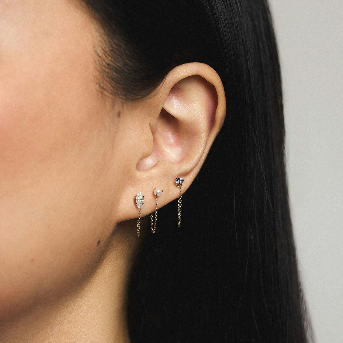 Single Removable Connector Chain paired with Mini Marquise Crystal, Pearl in 3mm, and Sapphire Nap Earring On Model (Gold)