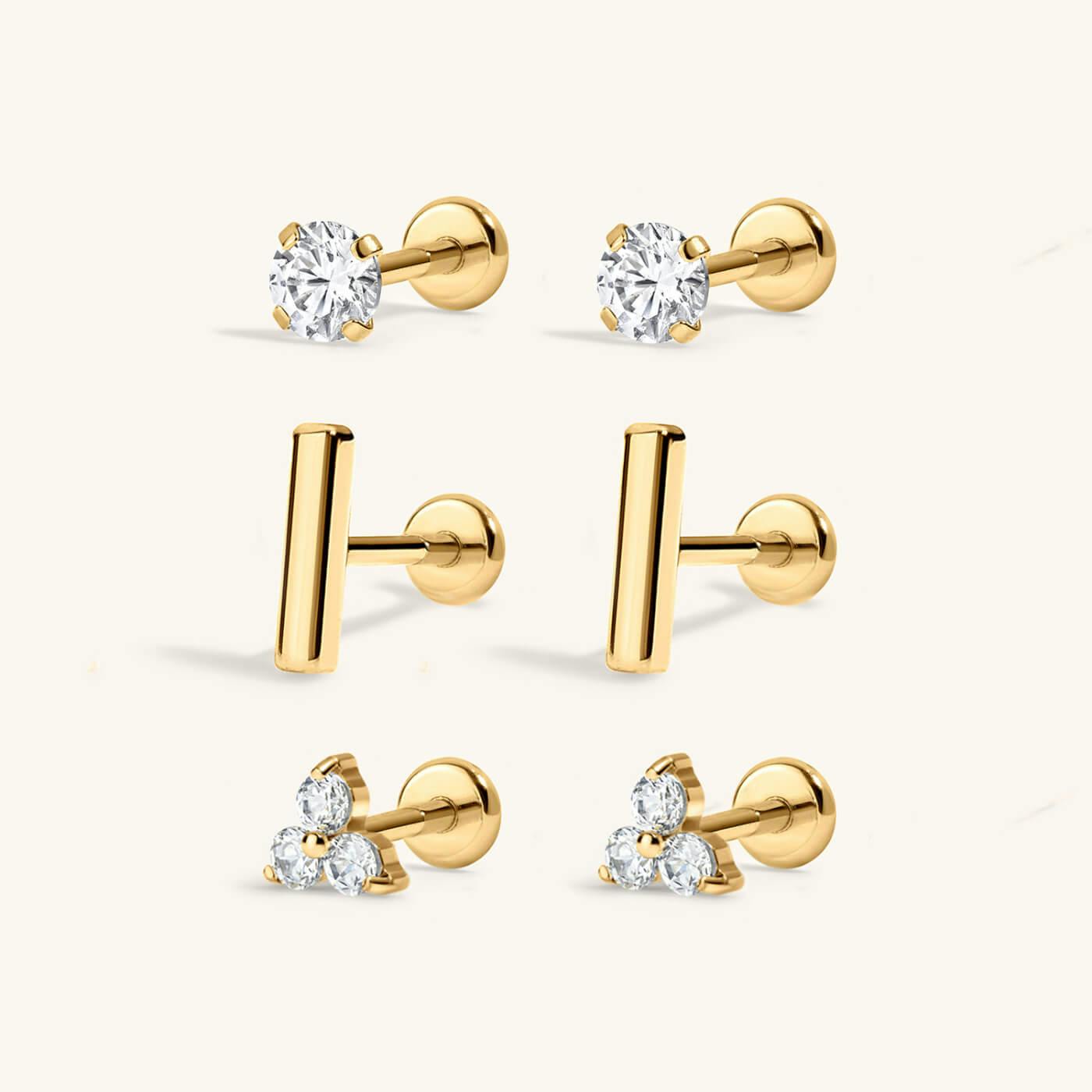 Everyday Nap Earrings Trio in titanium (gold) with Celestial Crystal Nap Earrings, Little Bar Nap Earrings and Mini Crystal Trinity Nap Earrings