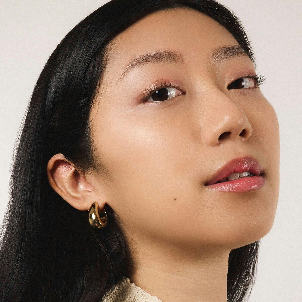 Dewdrop Hoops in Titanium - On Model (Gold)