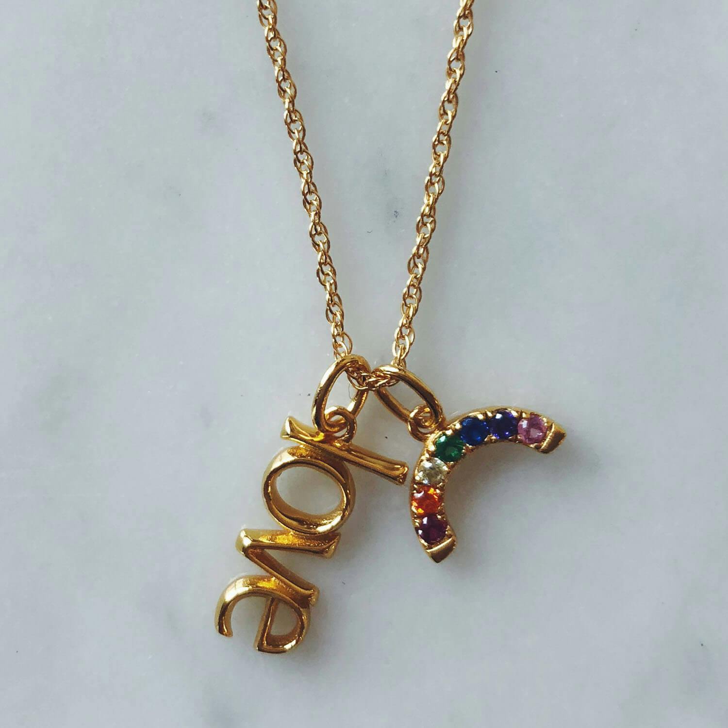 Rainbow Charm in Gold Vermeil on table