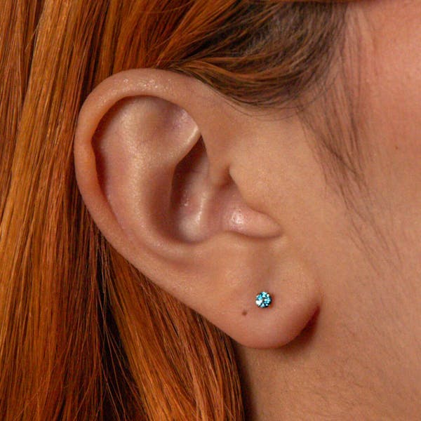 Blue Topaz Nap Earrings in Gold on model