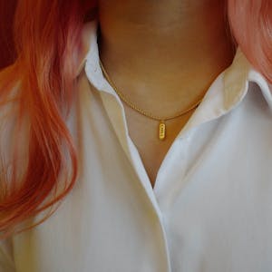 Chill Pill Necklace in Gold on model