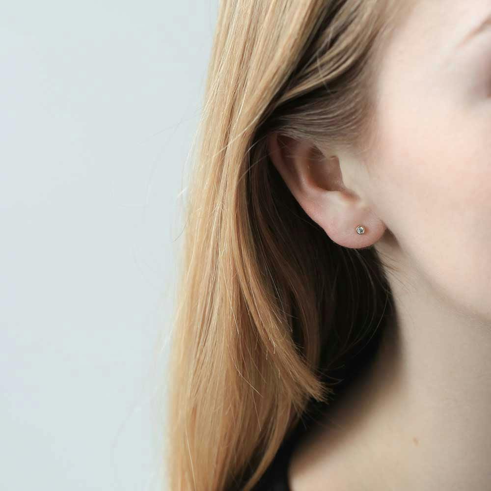 Tiny Crystal Studs in Sterling Silver on model