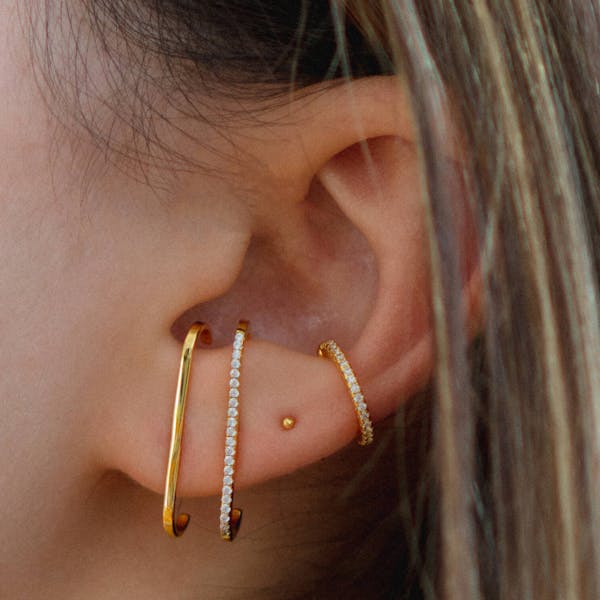 Tiny Secret Ball Back Earrings in 14k Gold on model