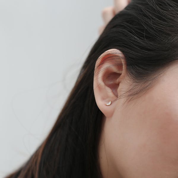 Pave Moon Studs in 14k Gold on model